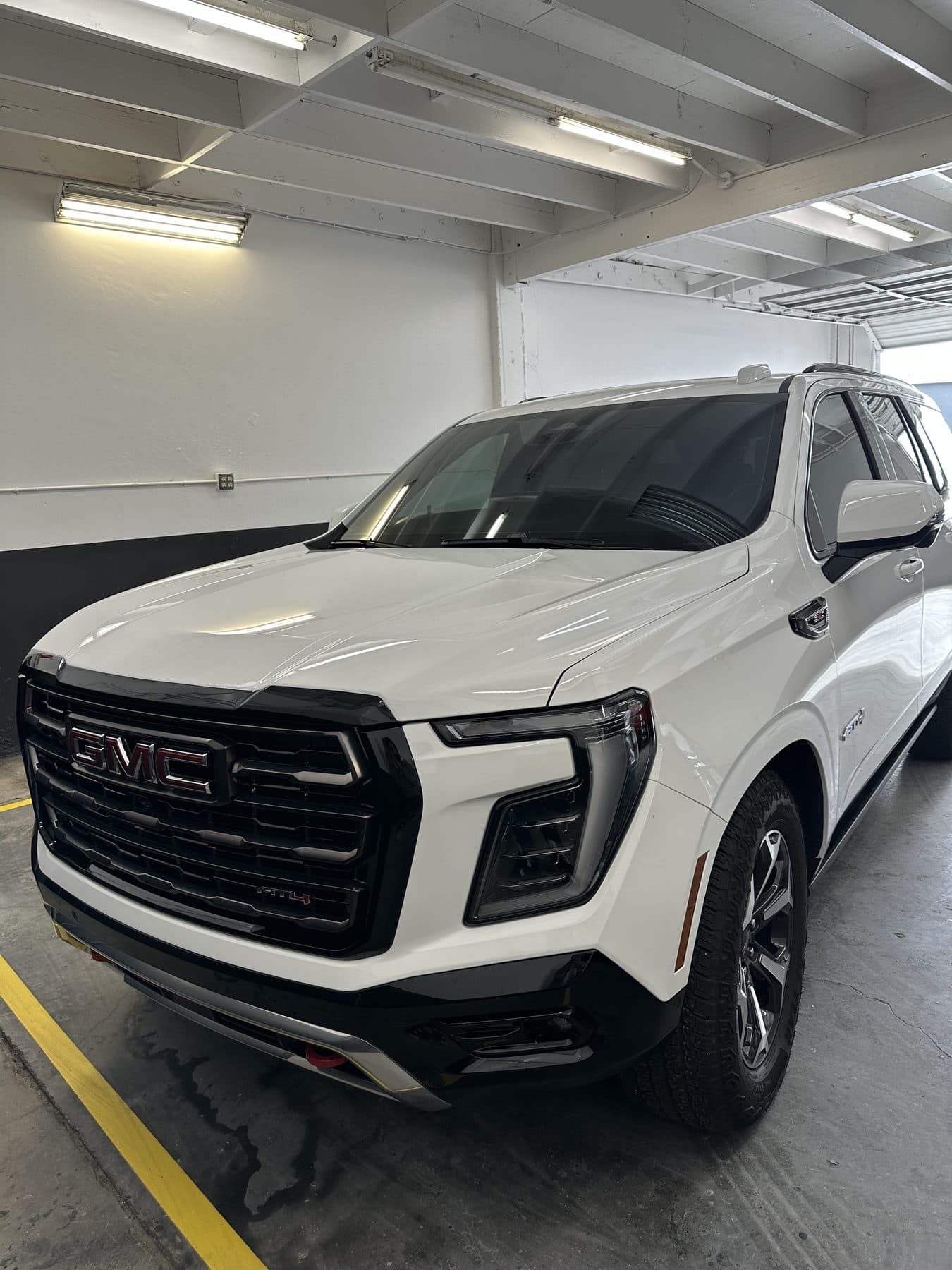 White GMC Yukon AT4, front view